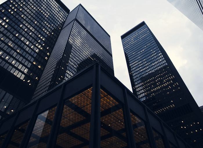 Office towers rising against an overcast sky